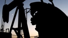 Oil hovers near $103 amid mixed US supply signs