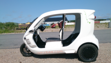 Light weight electric car makes use of FRP panels and structural adhesives